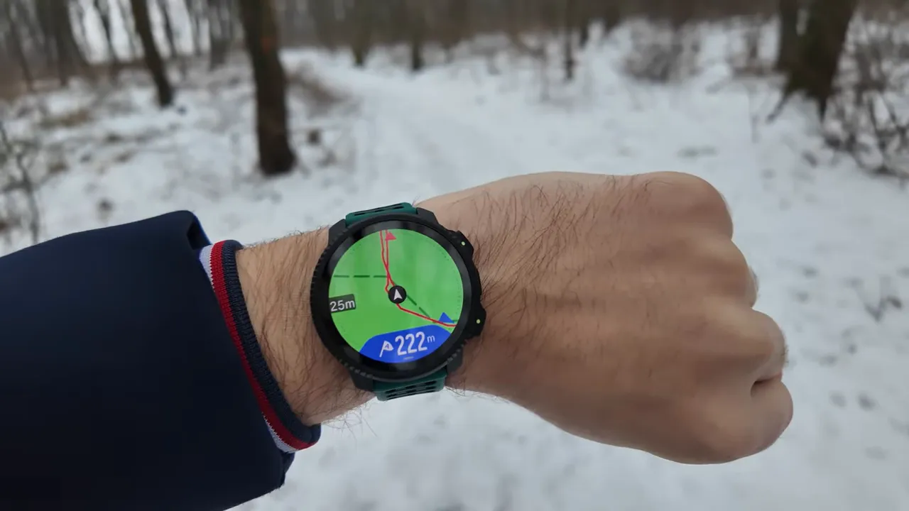 Suunto Vertical 2 showing an offline color map with breadcrumb route and distance on the watch face, snowy trail background