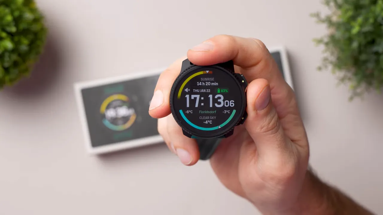 Suunto Vertical 2 AMOLED display clearly showing time, battery percentage and weather on a bright, colorful watch face.