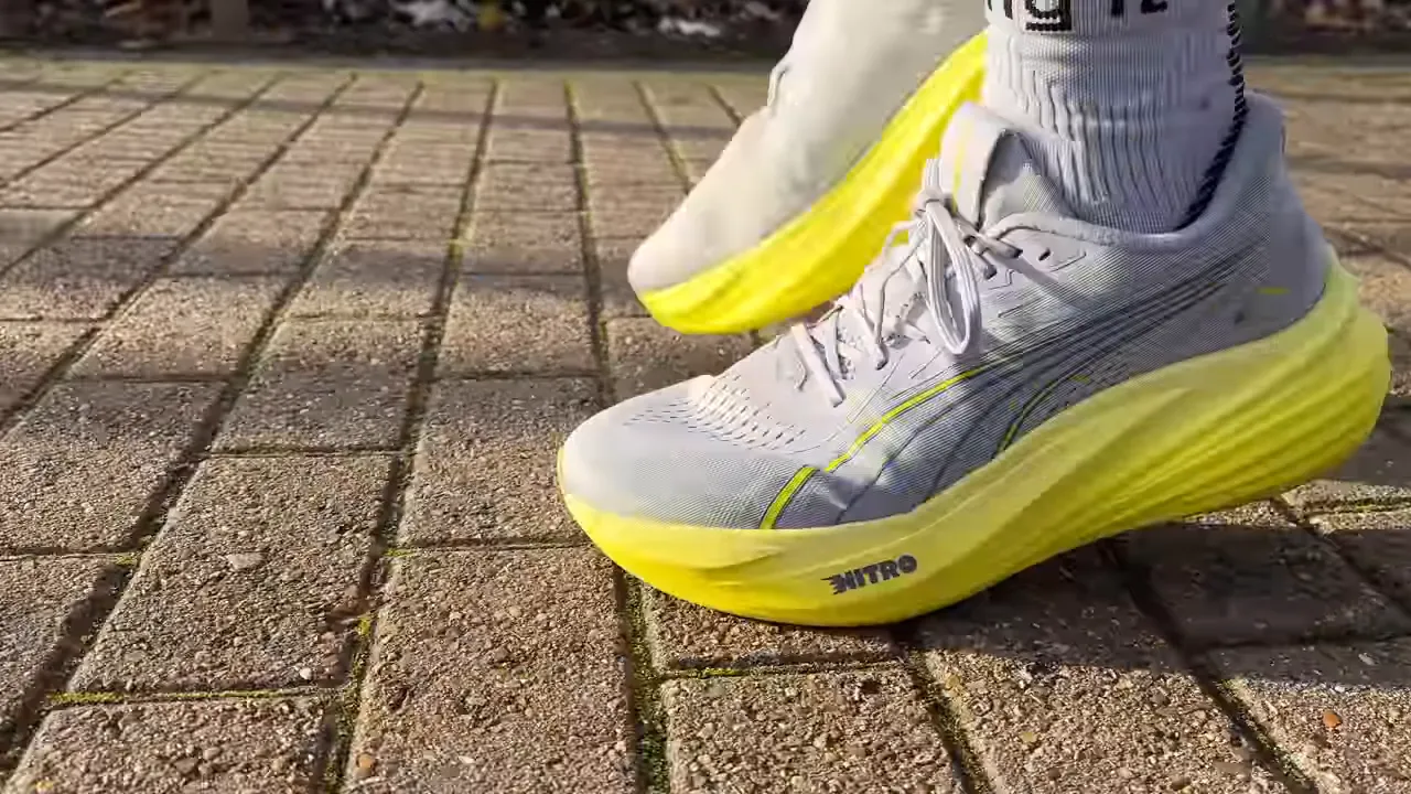 Puma MagMax 2 on pavement showing yellow Nitro midsole and outsole contact
