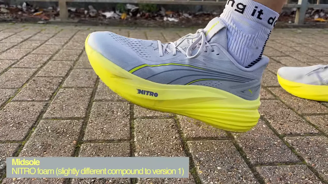 Side profile of the Puma MagMax 2 on pavement showing the high stack, sculpted midsole and NITRO branding