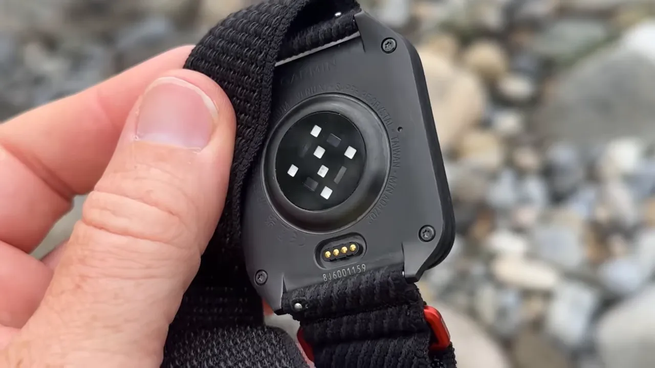 close-up of garmin venu x1 gen 5 optical heart rate sensor and charging contacts