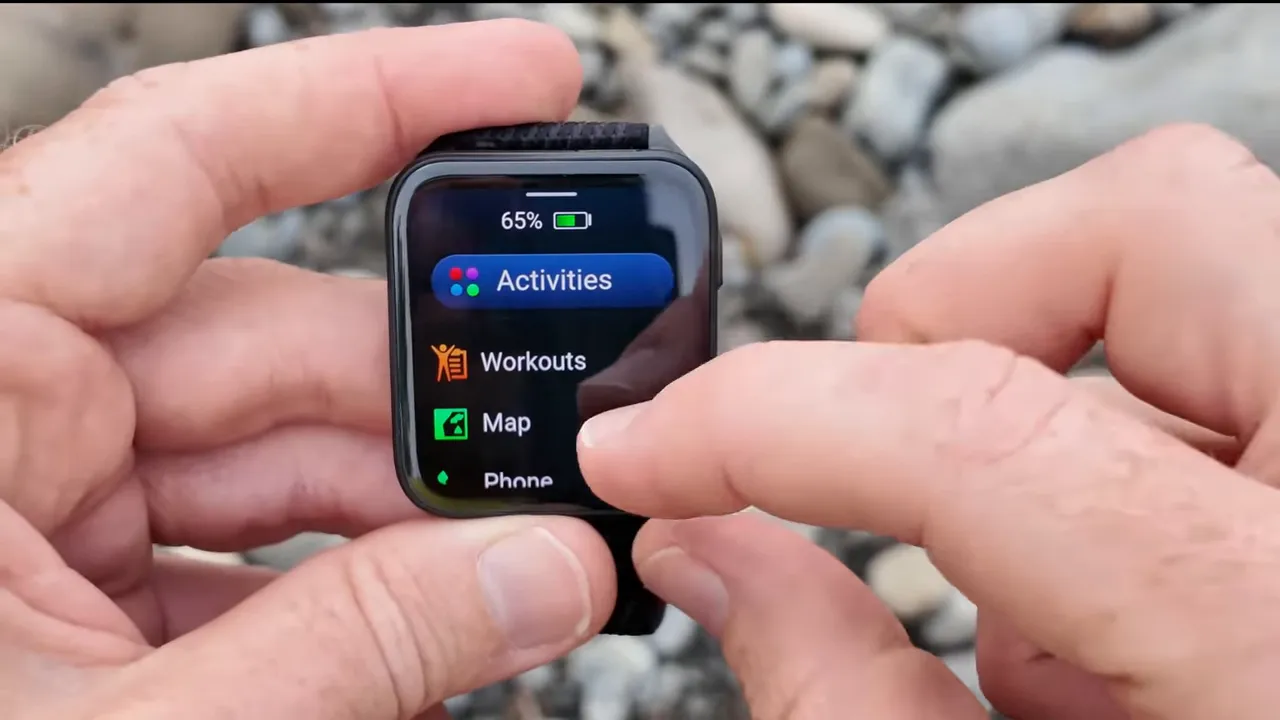 Garmin Venu X1 activities menu showing Workouts, Map and Phone with battery indicator