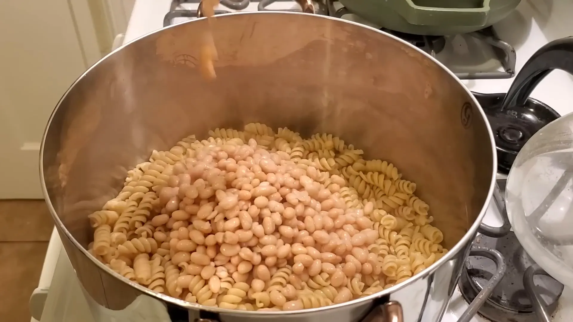 Whole wheat pasta with pesto and beans.