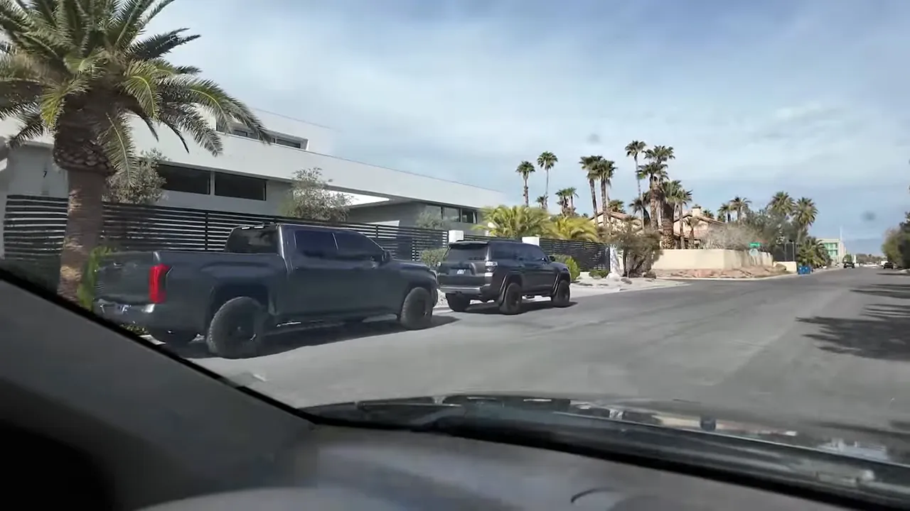 Drive-by view of large estate homes in Section 10 Las Vegas with long frontage and privacy fencing