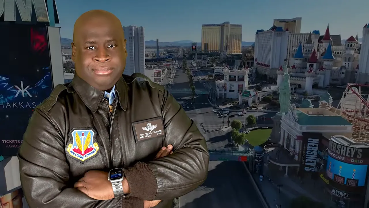 Presenter in flight jacket with folded arms in front of the Las Vegas Strip