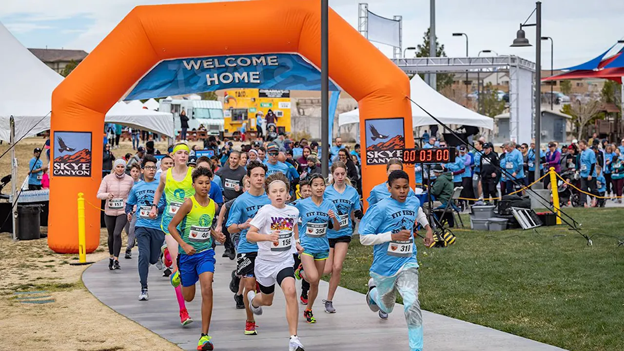 Families and neighbors interacting at a community event in a park