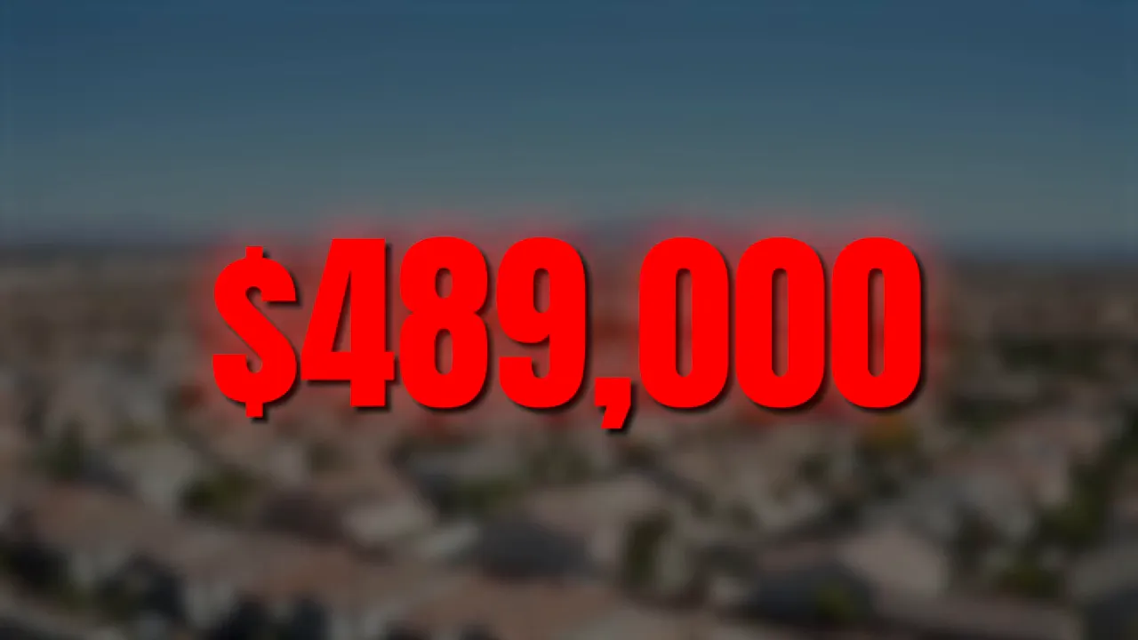 Big red text '$489,000' over a blurred aerial neighborhood background highlighting the median home price.