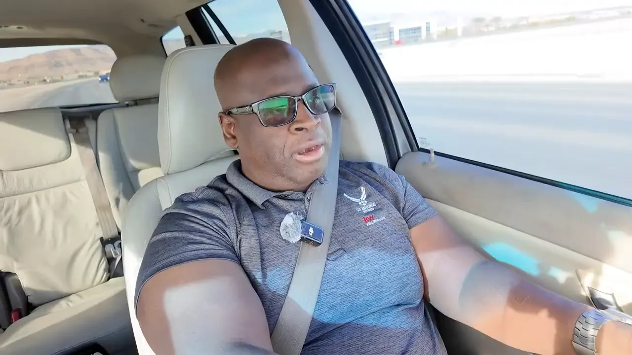 Speaker in car looking slightly off-camera while explaining the importance of context.