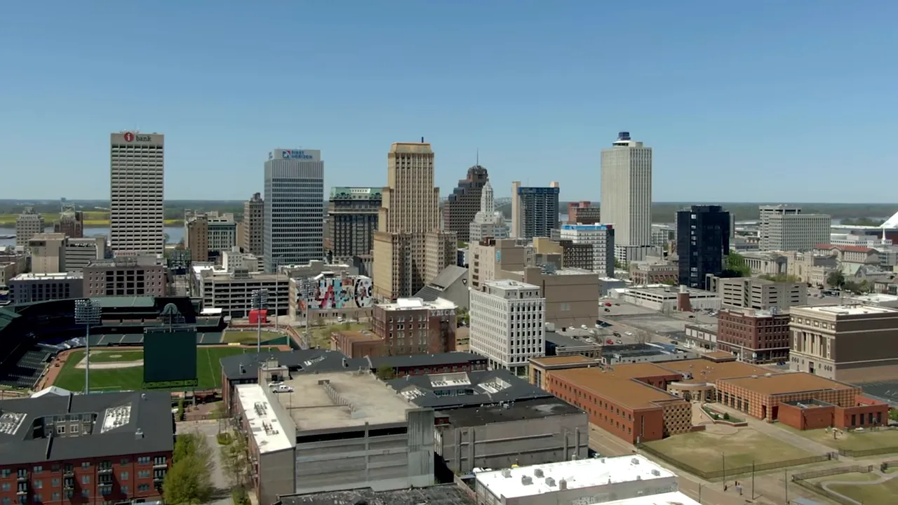 Wide skyline view of a city with downtown buildings and streets
