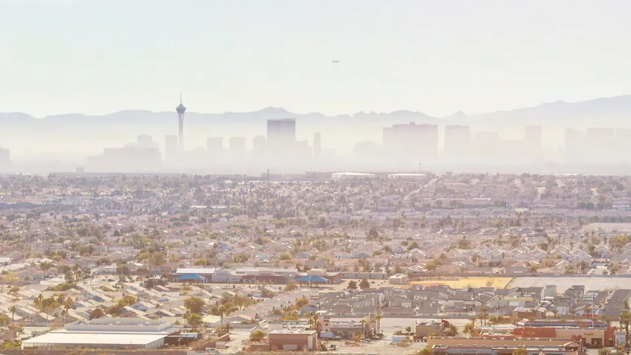 aerial view of Las Vegas suburbs with skyline and distant mountains