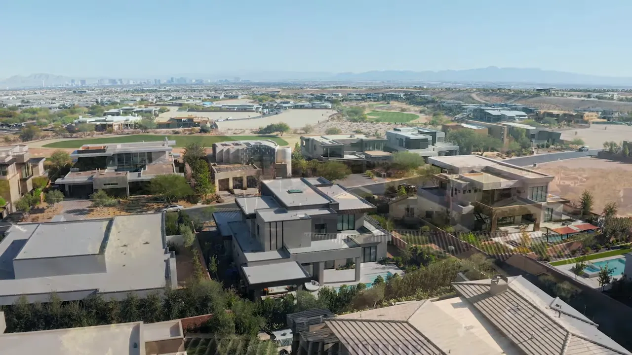 Aerial view of a modern Las Vegas residential community with homes and landscaped areas