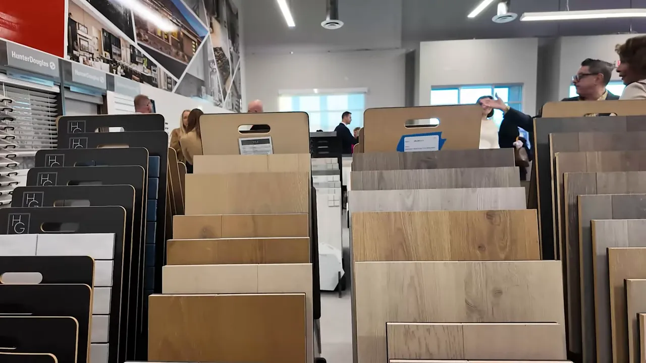 Flooring sample display at the Richmond American design center with multiple wood-look and tile-look options