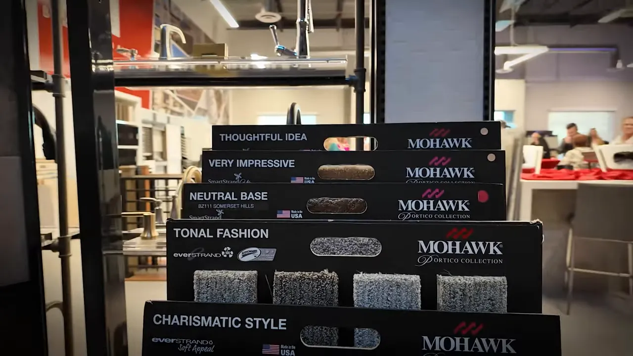 Mohawk flooring style boxes and carpet texture samples at a design center