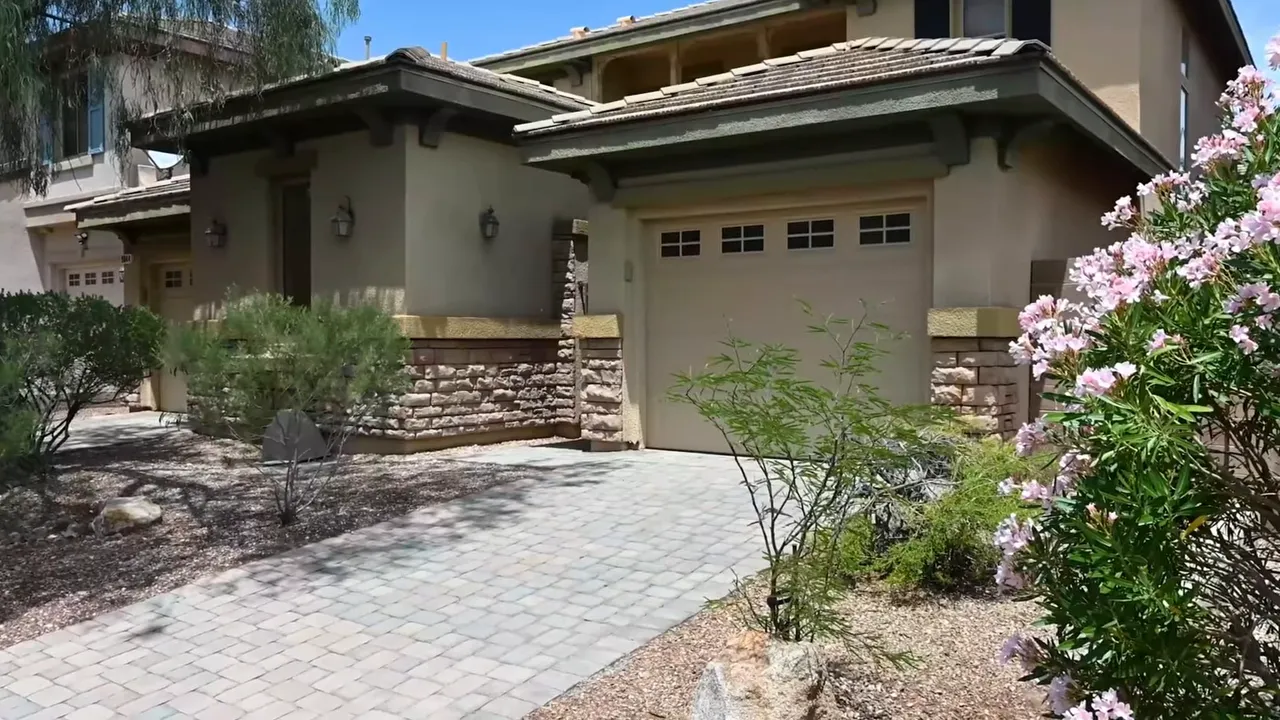 Modern suburban home exterior with driveway, front yard, and garage