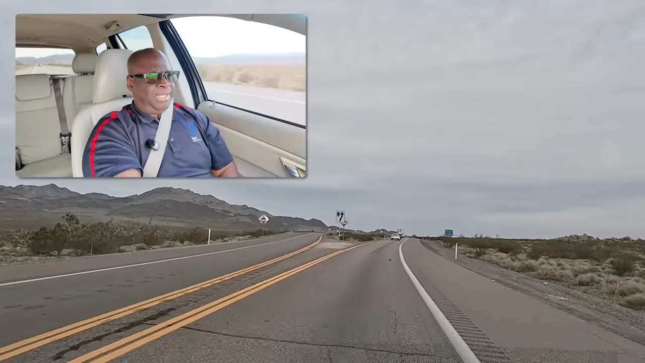 US-95 highway stretching ahead through desert terrain near Indian Springs