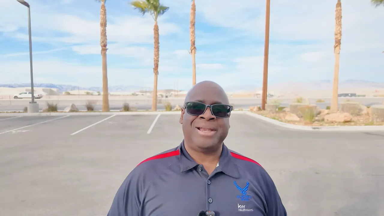 Presenter outdoors near Creech AFB explaining assignment history and morale factors
