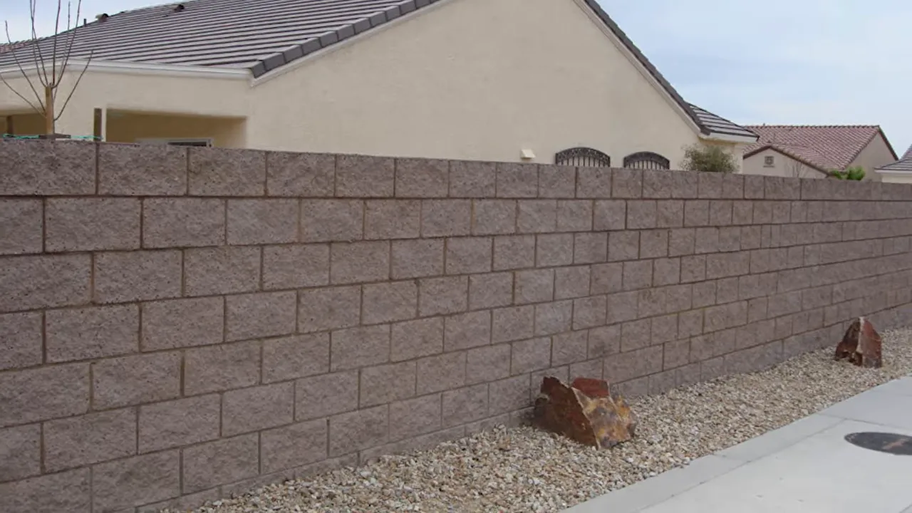 Fence wall panel damage near a residential property in Las Vegas from spring wind