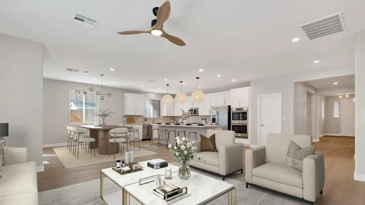 Bright open-concept living room and kitchen inside a new home