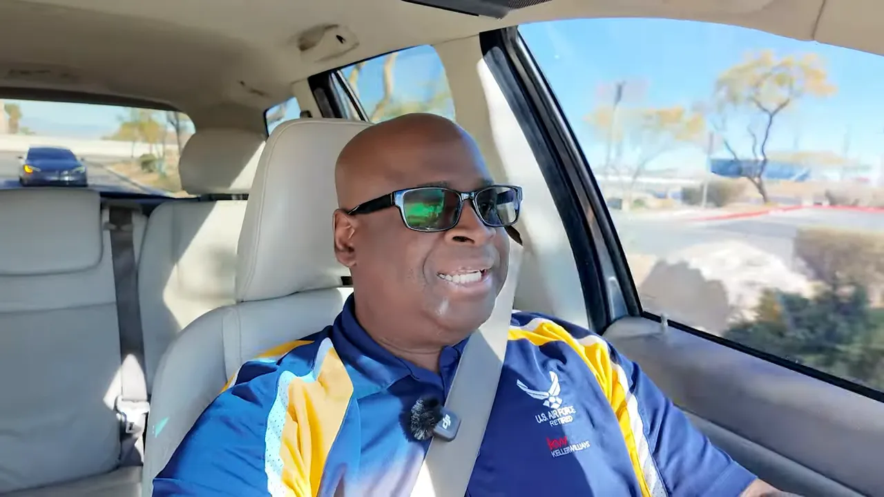 Real estate expert speaking in a car with storefronts and roads in the background