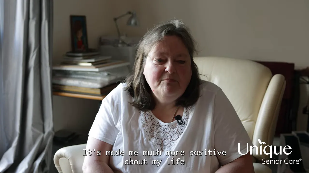 Heather smiling while talking about how care made her more positive