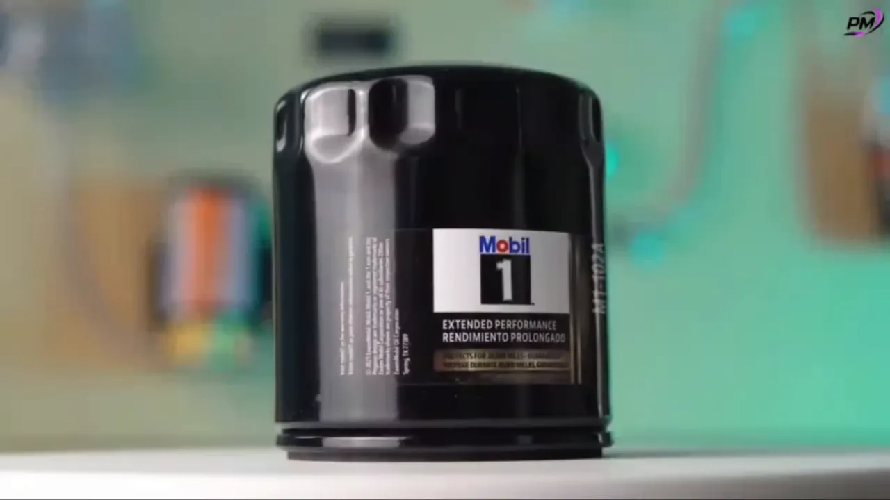 Close-up of a black Mobil 1 extended performance oil filter canister on a table