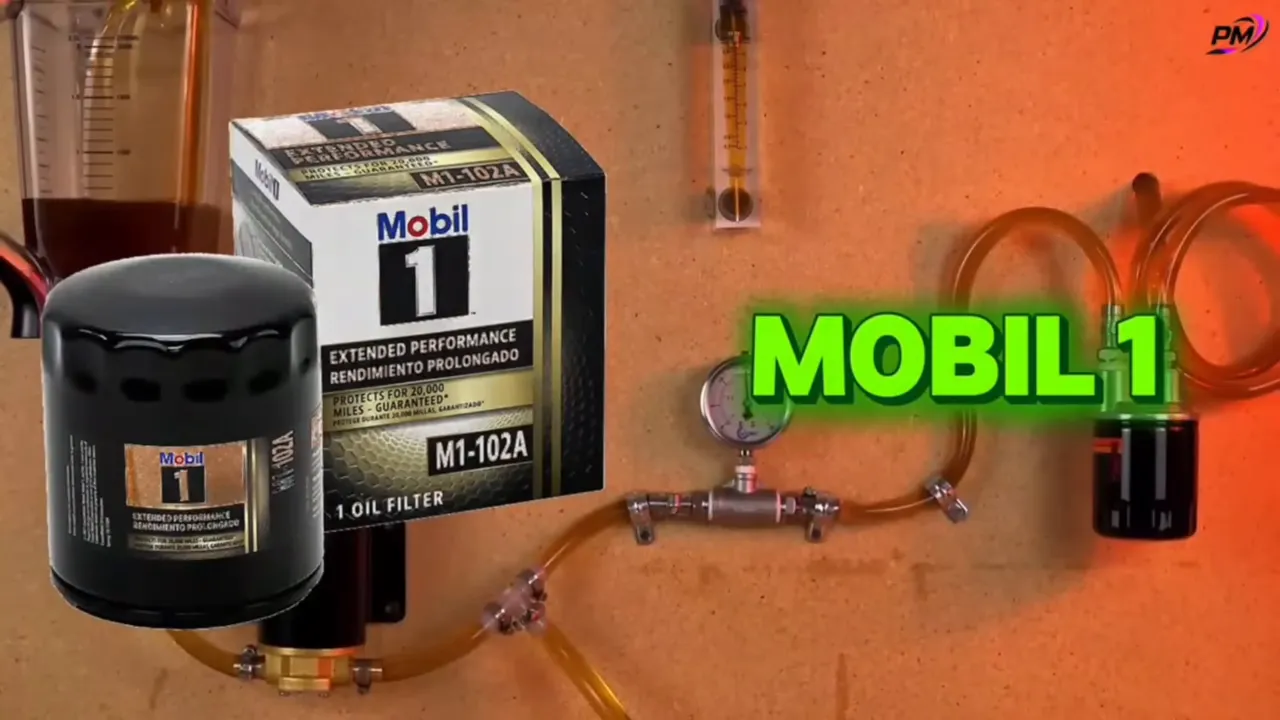 Mobil 1 oil filter canister and boxed product with test rig and large 'MOBIL 1' title graphic