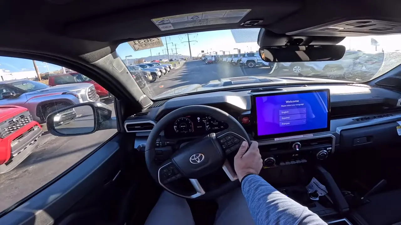 Driver perspective showing Tacoma digital instrument cluster and center infotainment display