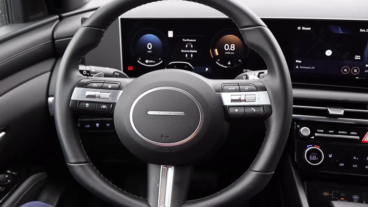 Hyundai Santa Cruz steering wheel centered showing buttons, paddle shifters and digital instrument display