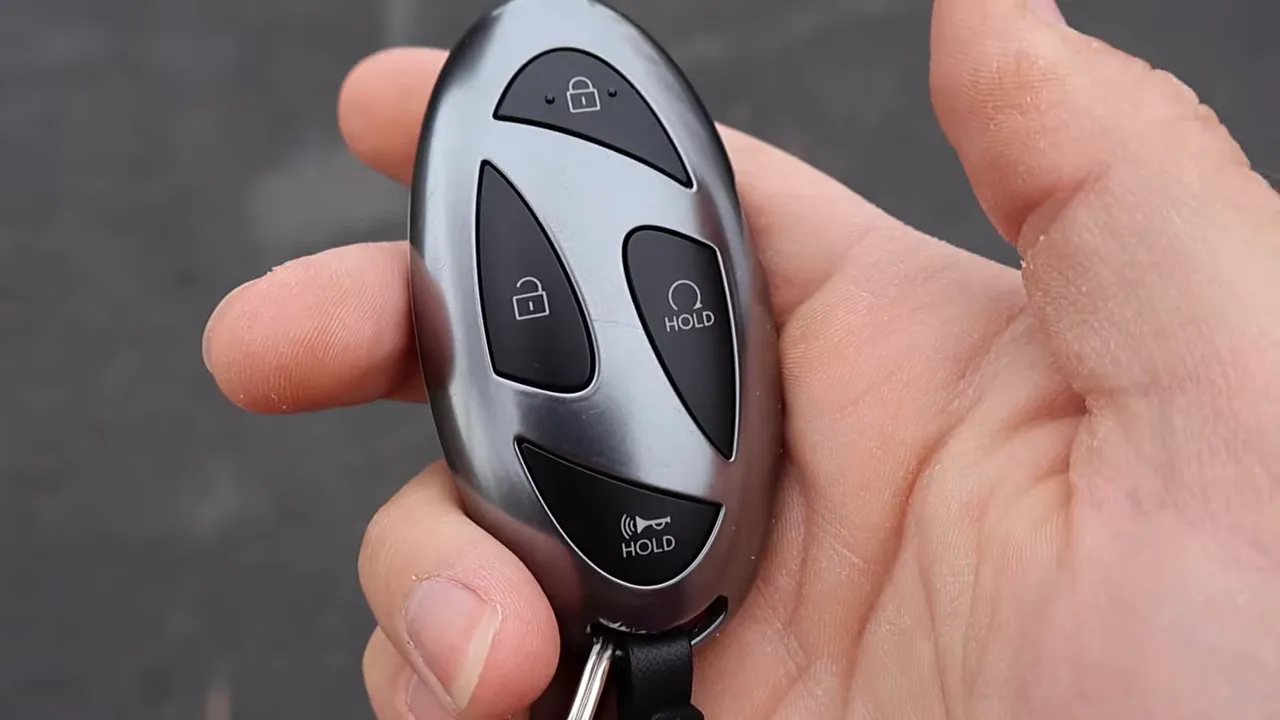Close-up of Hyundai Santa Cruz key fob front showing lock, unlock and hold buttons