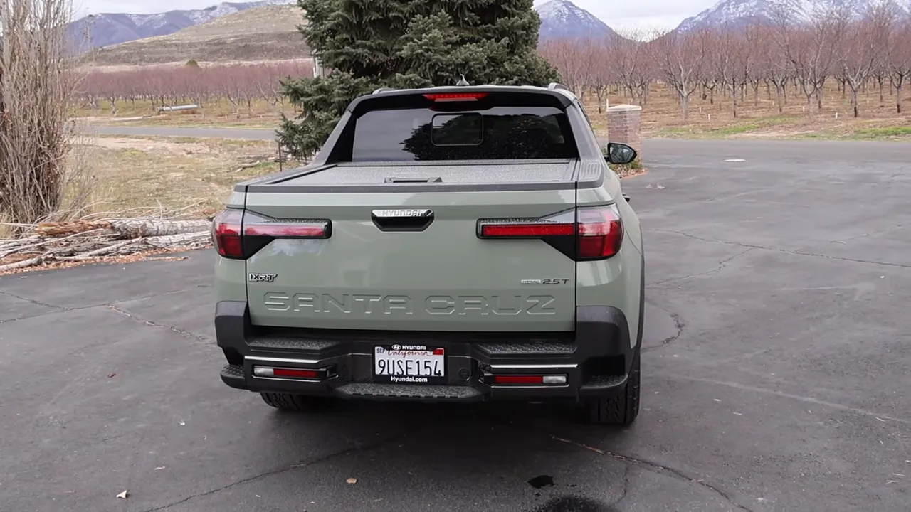 Rear of Hyundai Santa Cruz showing bumper steps and embossed tailgate