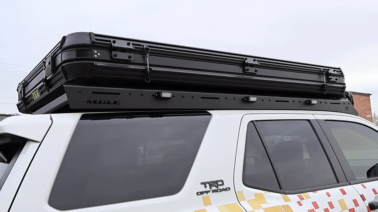 Rooftop tent and rack mounted to Toyota 4Runner using factory mounting points, showing mounting points and TRD badge