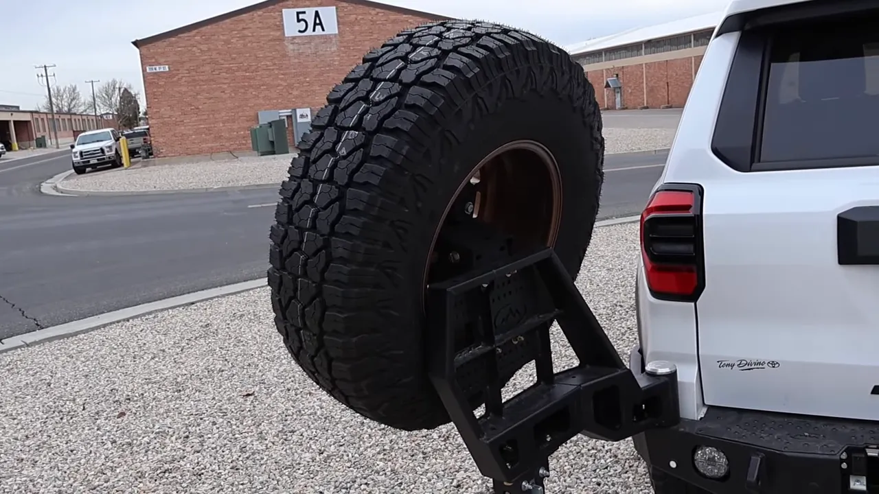 Toyota 4Runner rear spare tire on Expedition One swing-out carrier and steel rear bumper