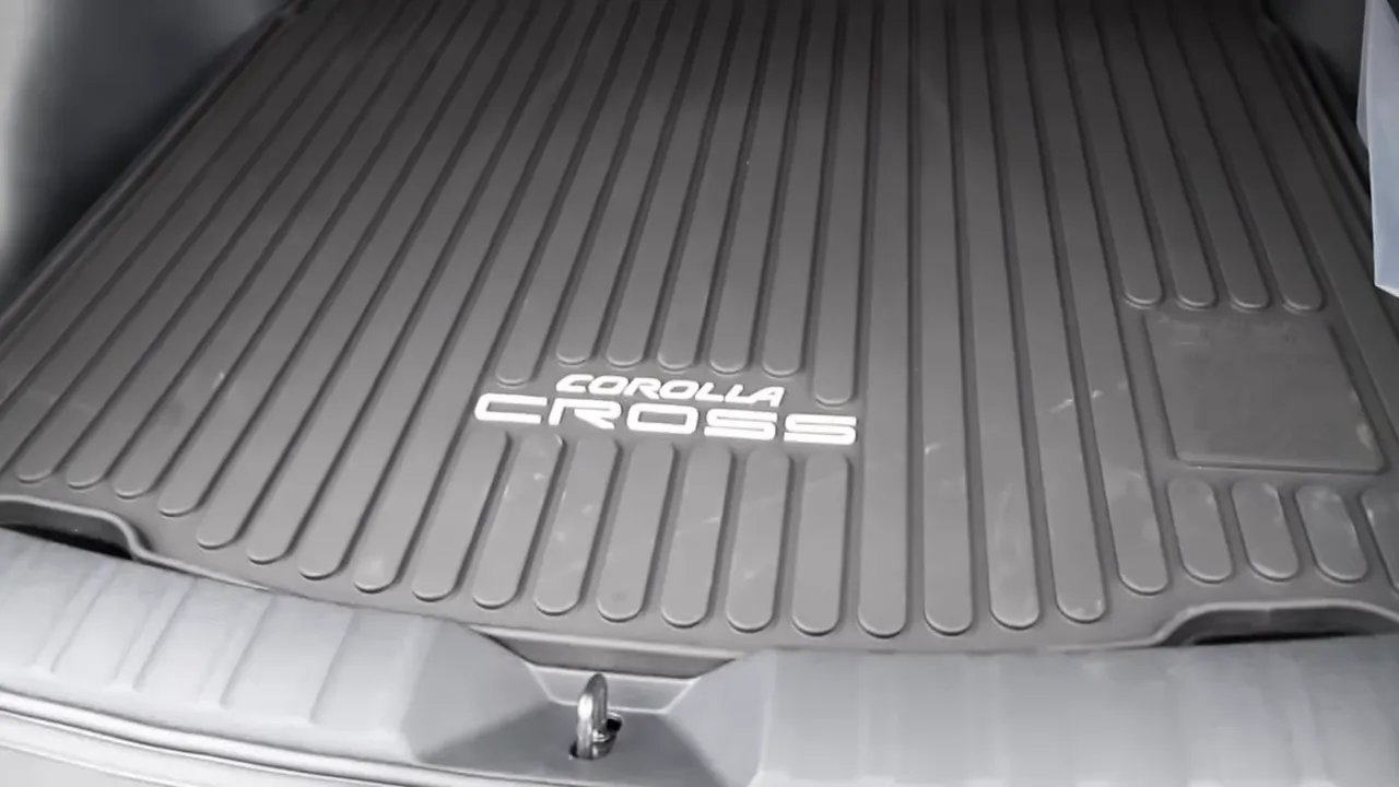 Corolla Cross rubber cargo mat with embossed 'Corolla Cross' logo in trunk