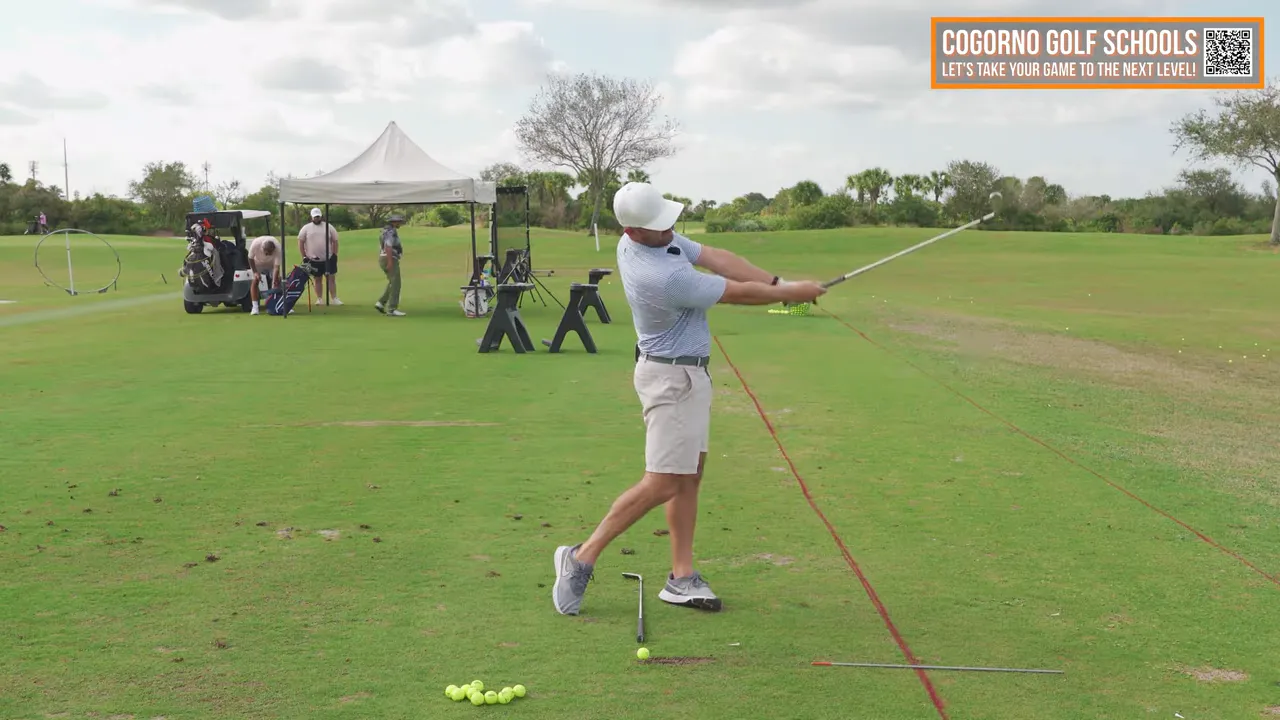 Golfer in full follow‑through demonstrating rotation, extension and the club pushed away from the body