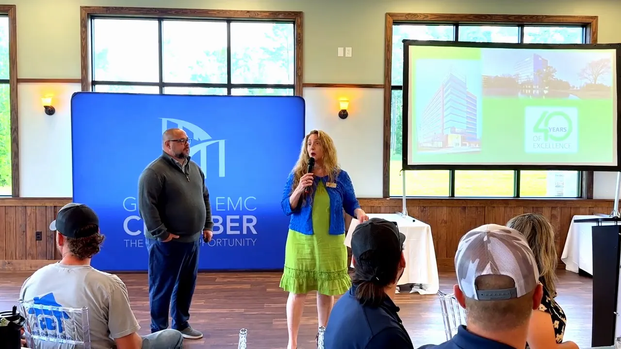 Insperity presenter speaking at the Business Networking Breakfast with slide on screen