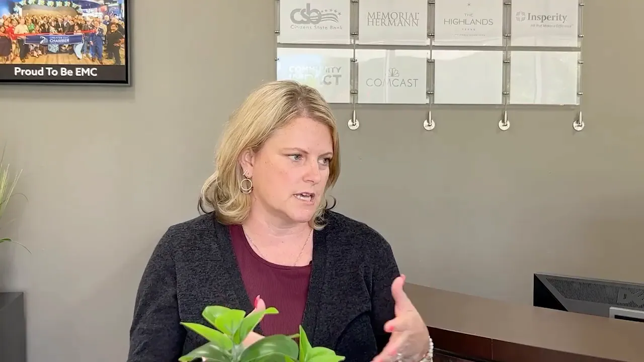 Jessica Penny speaking and gesturing during an interview in a chamber office
