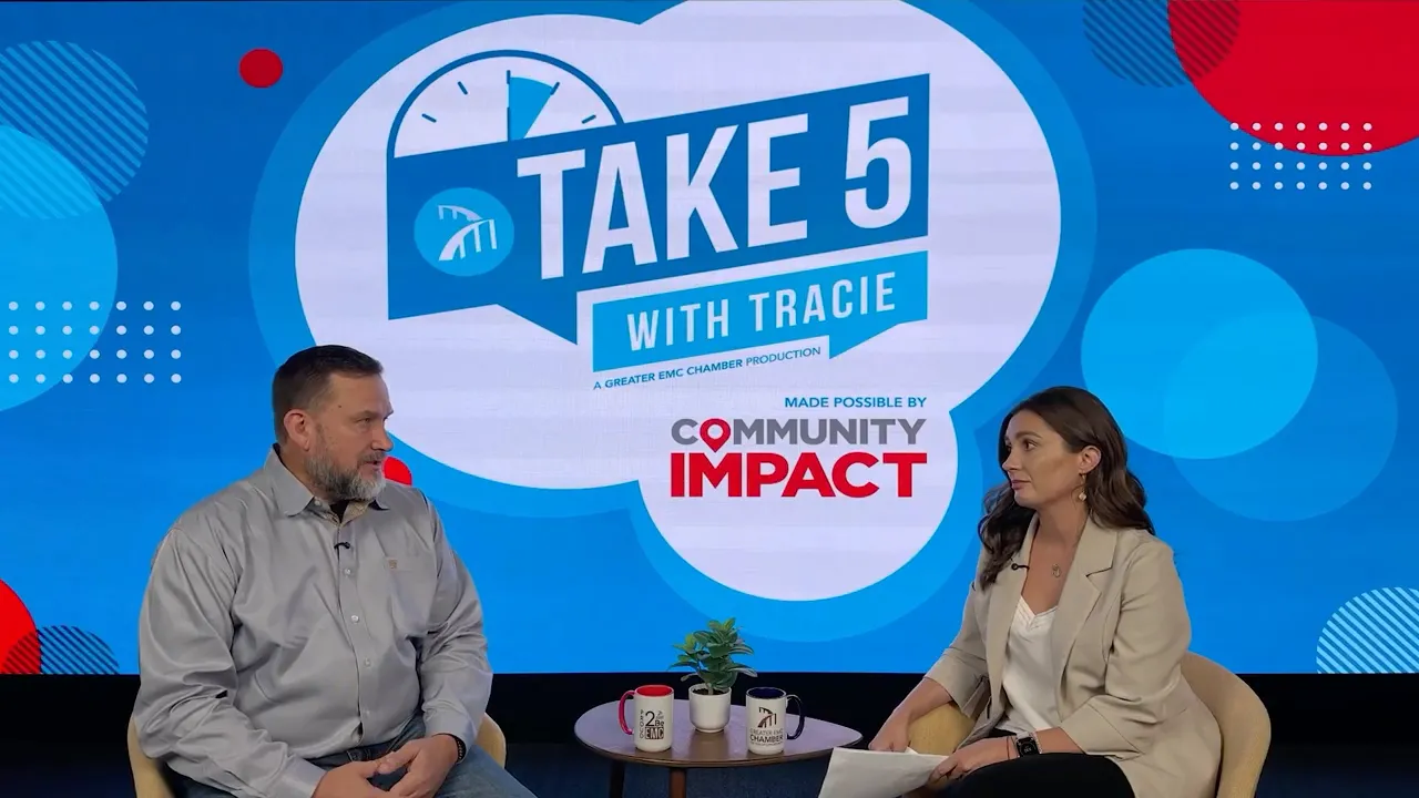 Tracie and Travis Schmidt seated on “Take 5 with Tracie” set with “Winter Rose Crusade” interview backdrop