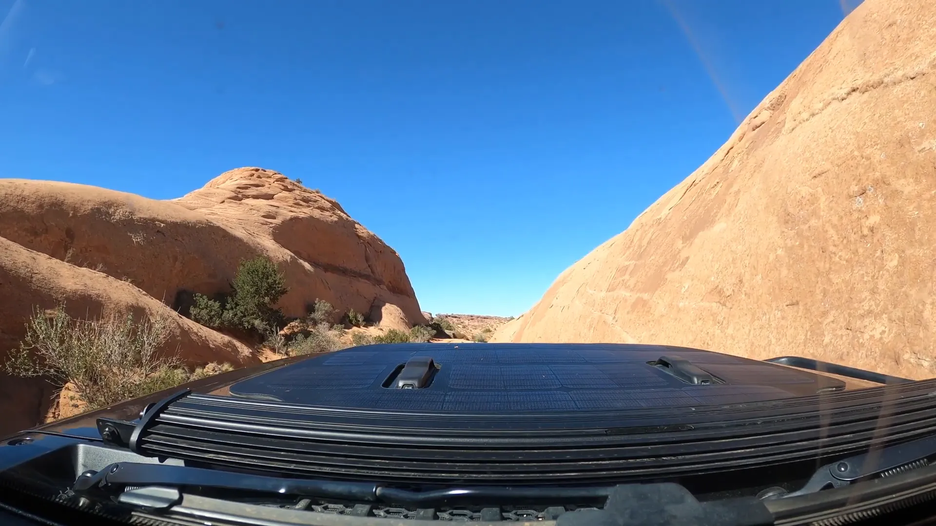 Jeep navigating the slick rock climb