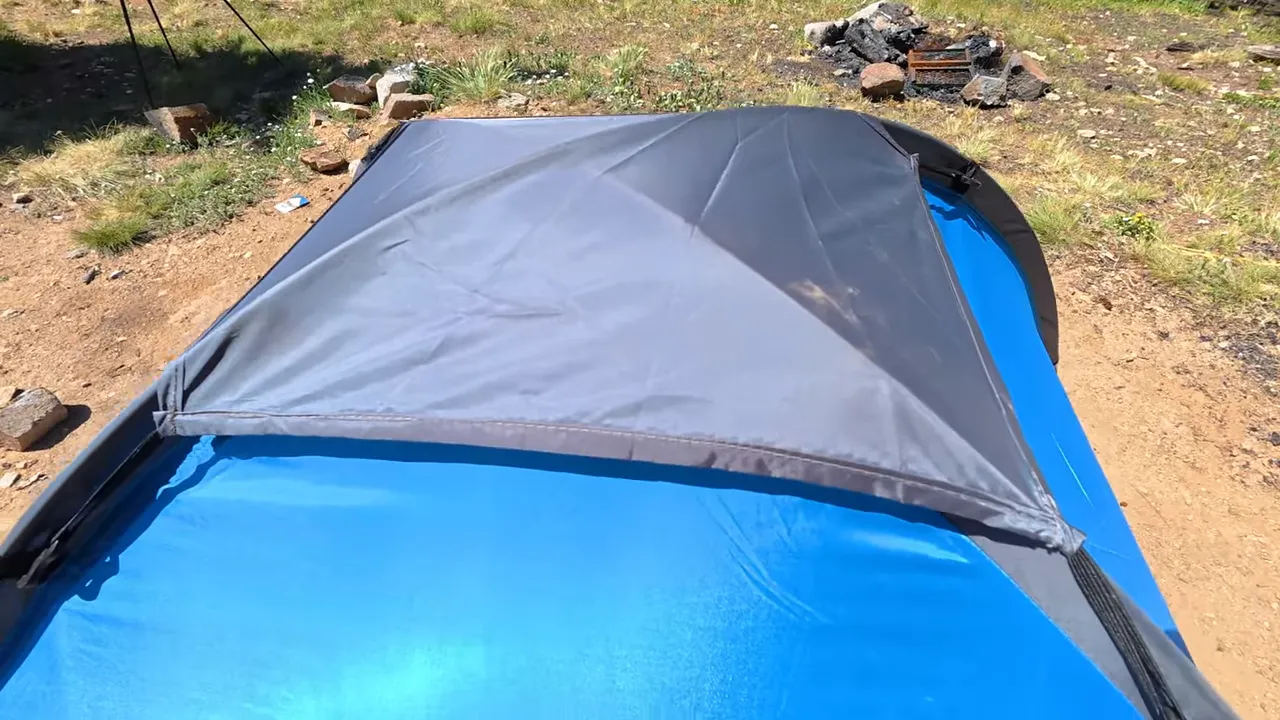 Assembling the $20 tent with two poles and stakes