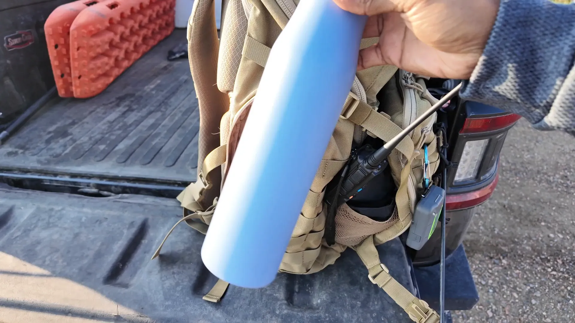 Side pocket holding a large water bottle