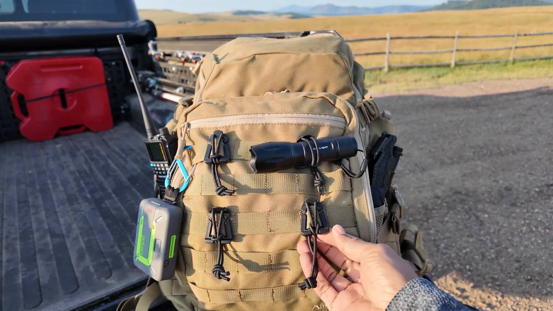 Front pouch with MOLLE webbing and attached accessories