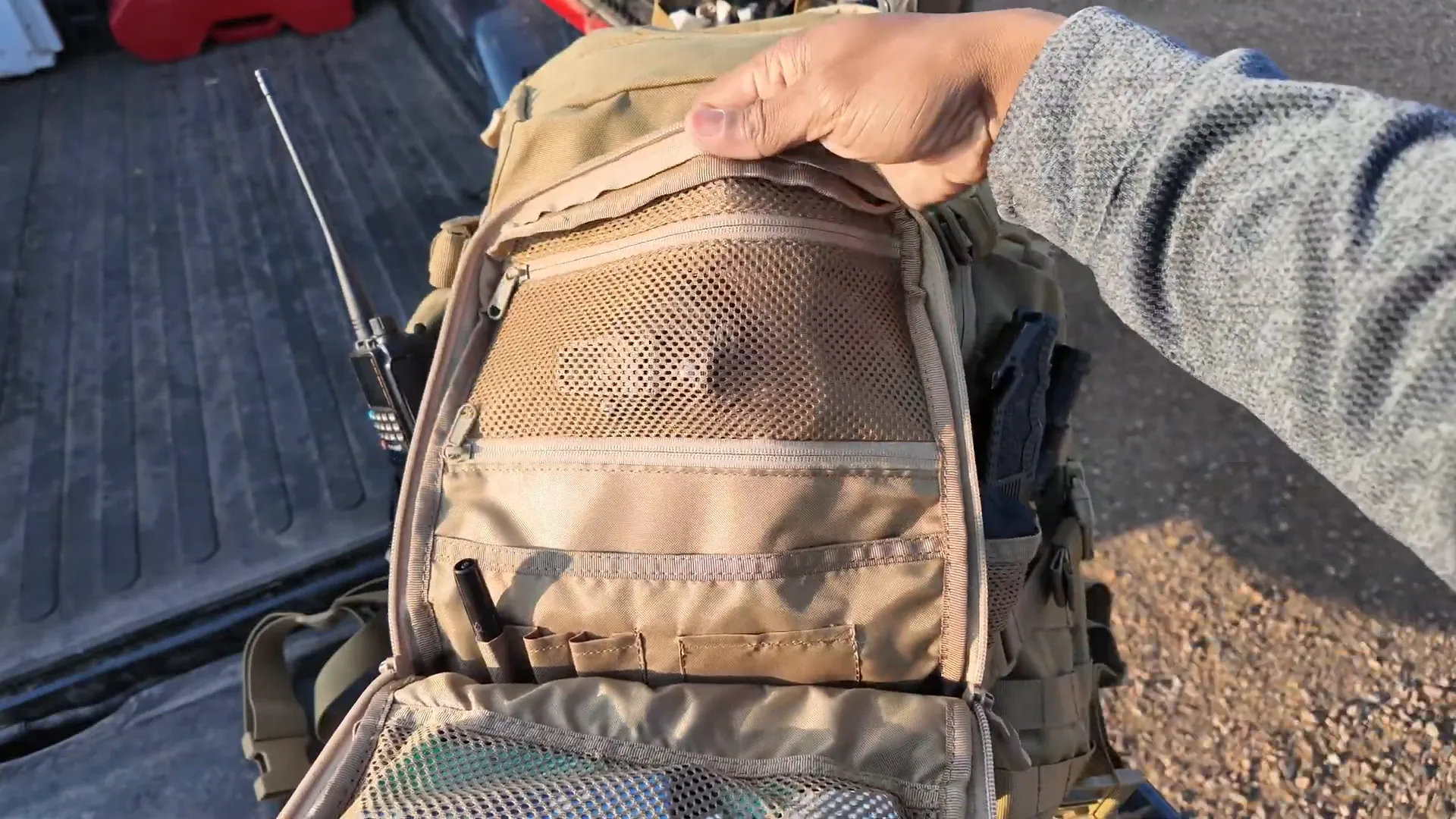 Front pouch unzipped showing inner zippered pockets