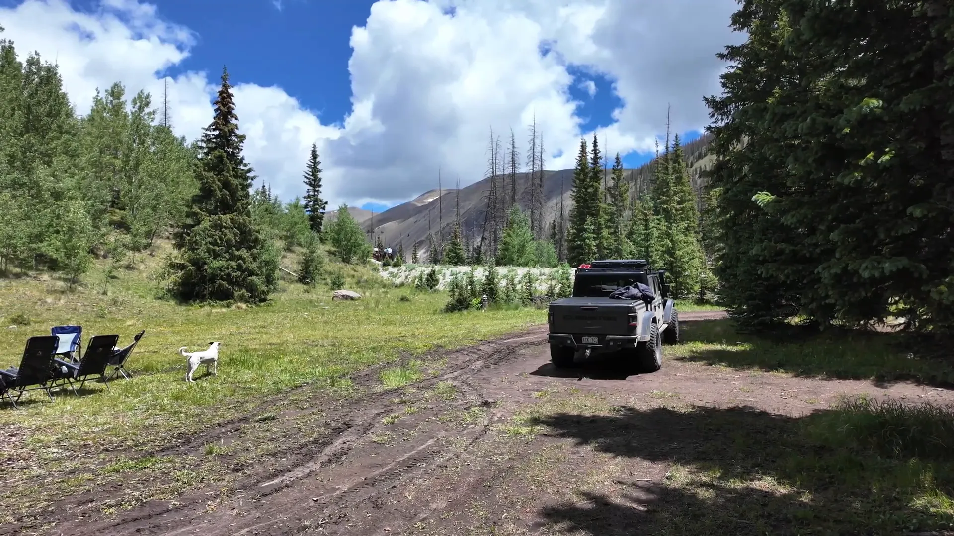 Campsite located right by the road with side-by-sides passing
