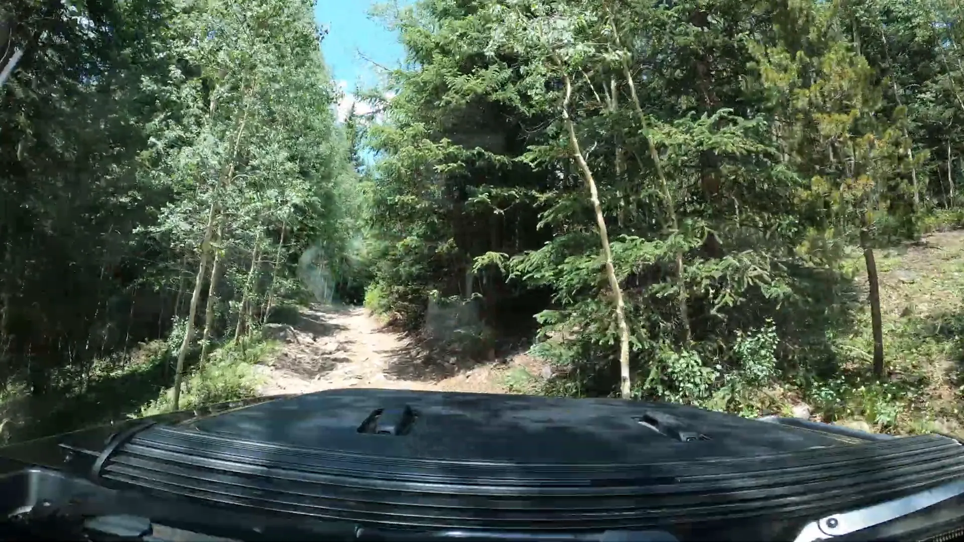Rocky terrain of Chihuahua Gulch Trail with Jeep navigating