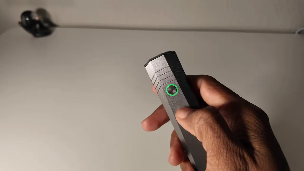 Battery level indicator ring around the power switch showing green