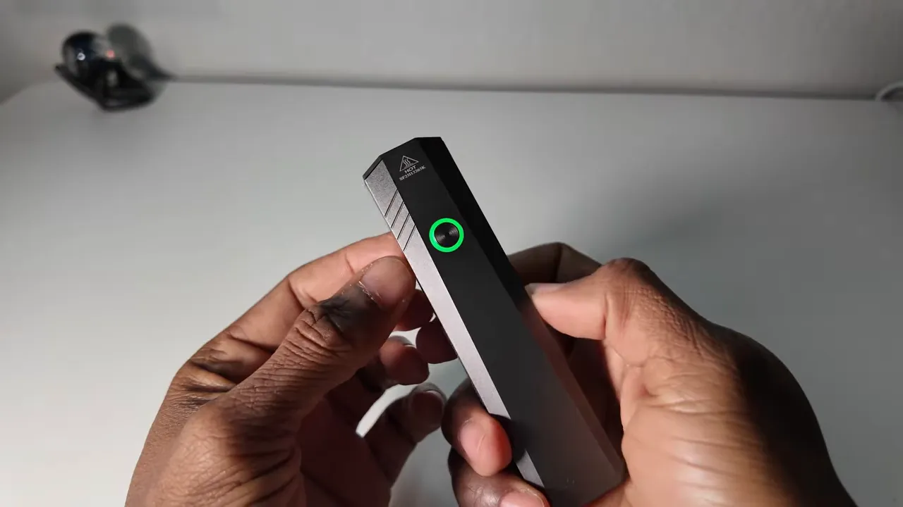 Close-up of the single button and USB-C port on the ST1