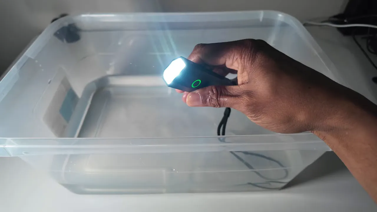 ST1 being submerged or placed near water to show water resistance