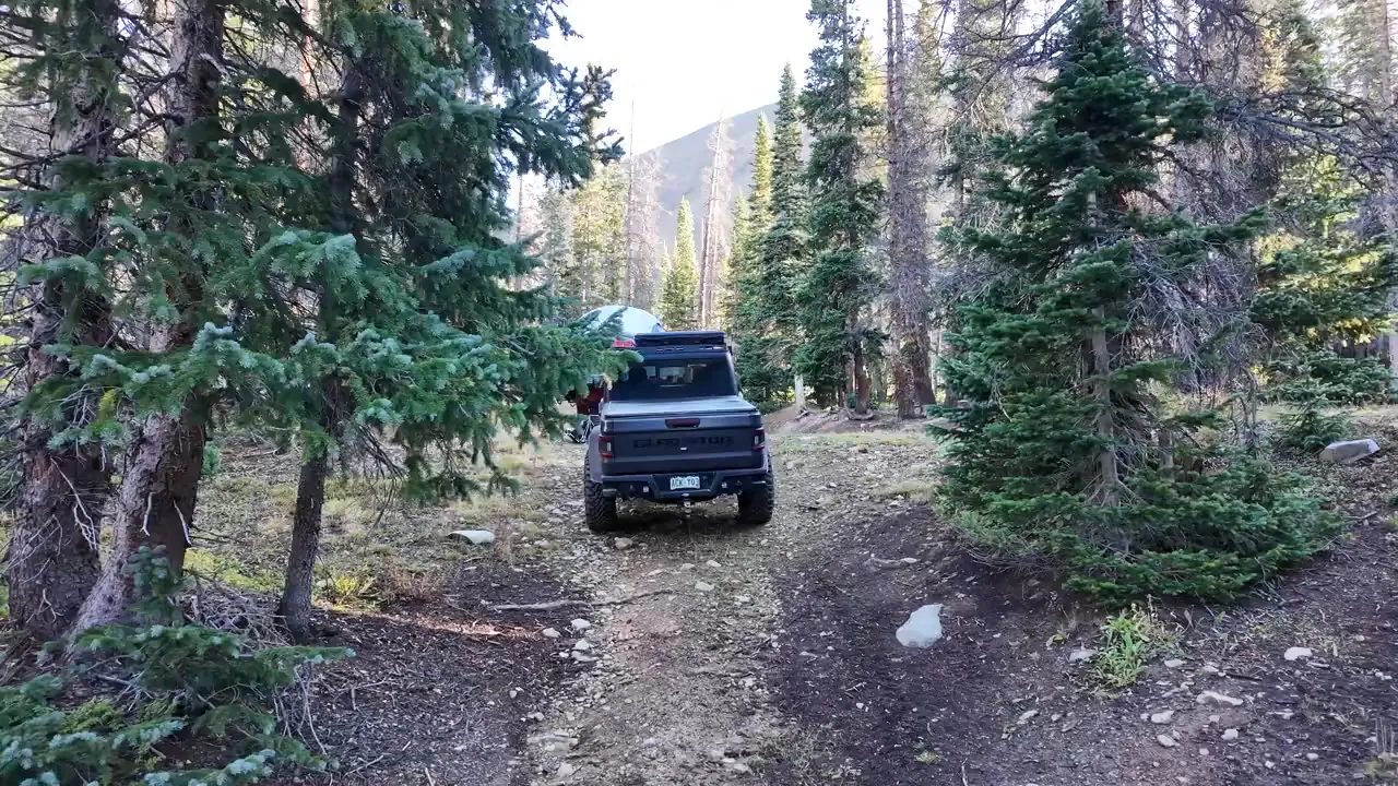 Opus OP4 camper parked at the Billing Lake Trail campsite