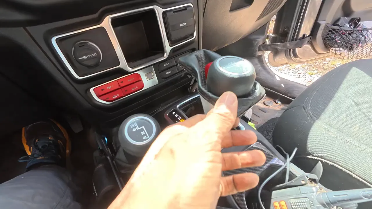 Close up of the shifter area where a cover was removed revealing the shifter mechanism that allowed neutral to be engaged