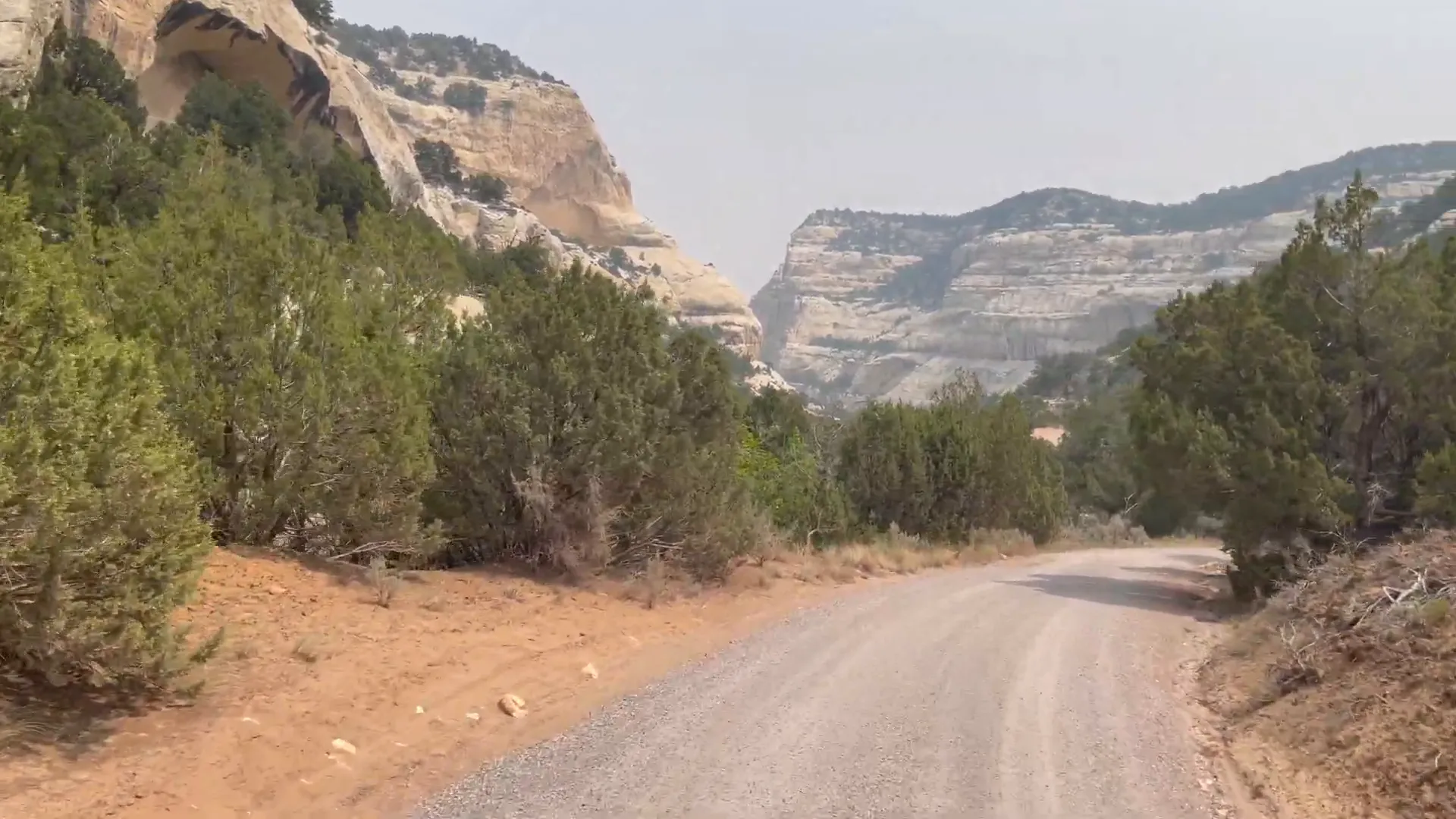 Sand Canyon entrance along Echo Park Road with towering canyon walls